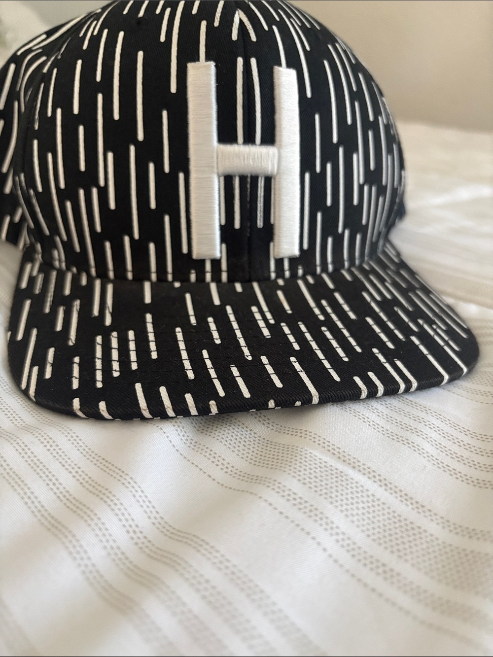 Herschel Supply Company Black and White Patterned Hat with 'H' Logo